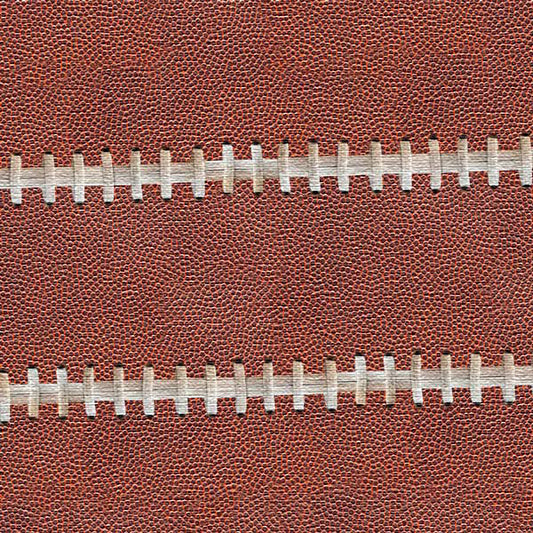 Close-up of a brown football with white stitching